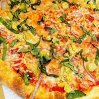 *Enlarged for texture* NY style pizza w/ vegan cheese & toppings ✨great crust!  at Tomato Pie Pizza Joint in Woodland Hills