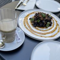 oat milk latte and eggplant starter  at Elaine's Greenhouse in Frankfurt