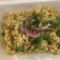 Side of rice topped with cilantro and onions  at The Vegan Vato in Victorville