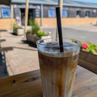 Delicious iced oat latte - their default is mylk which is so so so good of them at Fire & Flow Coffee Roasters in Cirencester