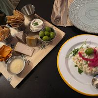Cheese board and Russian salad  at La Perra Verde in Barcelona