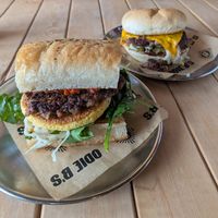 Vegan Boujee with Impossible Sausage (front), Double OD Burger with green chiles (back) at Odie B's in Denver