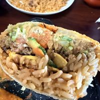 My burrito-half eaten but dude. It was amazing !  at El Cantaro Vegan Taqueria in Sacramento