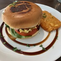 Egg and bacon roll with a hash brown   at Miss Sina in Marrickville