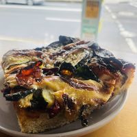 Pizza slices with veggies  at Miss Sina in Sydney