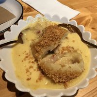 Plum dumpling with custard  at Miss Sina in Marrickville