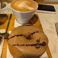 Vegan donut and oat milk coffee at Espresso Mafia  in Girona