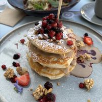 Delicious vegan pancakes with berries and tahini sauce toppings  at Baroque Le Bistrot in Kefalonia