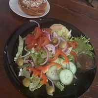 Cinnamon bun and custom vegan salad  at Café And The Bakery in Gothenburg