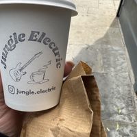 Oat flat white, cute cup  at Jungle Electric in East London