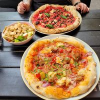 Pink Truffle Pizz, Spicy Meatballs Pizza and Vegan Caesar Salad at RAZZO Vegan Pizza Bar in Cologne
