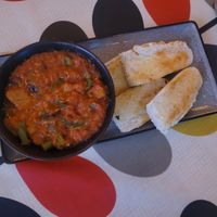 Plant Chicken Curry Bowl with Warm Mezzaluna Bread at Hooper's in Swansea