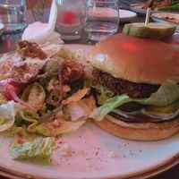 Tofu burger with Indian spices and side salad. at Good Intentions in St Petersburg