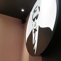 Logo in back of restaurant at VINCENT - The Playce in Berlin