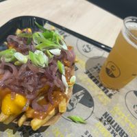 Animal style fries and appel schorle  at VINCENT - The Playce in Berlin