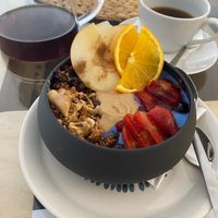 Granola bowl with filter coffee at Mishto Café & Deli in Budapest