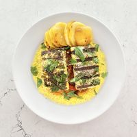 Grilled tofu fillet over couscous and middle eastern style veggies   at Veganista HI in Honolulu