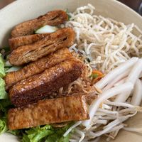 Grilled vegan meat with noodles and raw veg (my favorite, so flavorful and fresh)  at Mỹ Thoa Chay in Da Lat