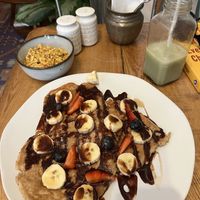 Pancakes, side of tofu scramble, half drank matcha   at The Vegan Shack in Panama City