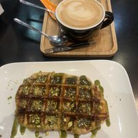 Pistachio waffle and decaf cappuccino 🥳  at Chocolate Bar Brugge in Bruges
