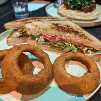 BLT with onion rings, Golden era chick-un & waffle in the background at Urban Vegan Kitchen in New York City