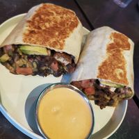 the get right within burrito
cilantro lime rice, black beans, buffalo buttermilk battered tofu, numu mozzarella, avocado, pico, flour tortilla
gluten free: burrito bowl with choice at Urban Vegan Kitchen in New York City