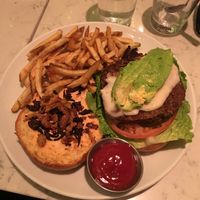 Vegan burger with, avocado and fries. Very delicious  at Urban Vegan Kitchen in New York City