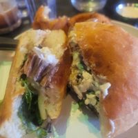 "Steak sandwich with onion rings. at Urban Vegan Kitchen in New York City