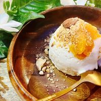 homemade vanilla coconut icre cream topping with homemade pineapple jam and cone so delicious  at Loving Hut Diệp Lâm Vegan in Ho Chi Minh City