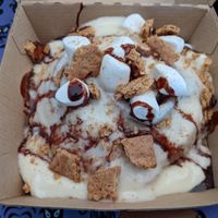 COOKIE MONSTER
cream cheese frosting topped with homemade chocolate chip cookie dough, chocolate chips & chocolate sauce (1107 cal) at Cinnaholic in Carmel