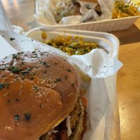 Crab cake in foreground  at Black Leaf Vegan Cafe in Indianapolis