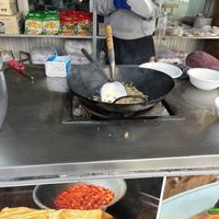 Watch the making of Pad Thai.  at Wat Huay Pla Kang in Chiang Rai