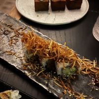 Fire cracker roll with 1,000 layer crispy potatoes in background. Roll was delicious, but the potatoes are worth skipping.   at Planta Queen in Chicago