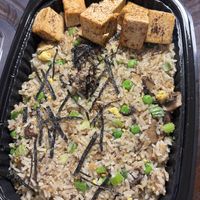 Mushroom fried rice with extra blackened tofu  at Planta Queen in Chicago