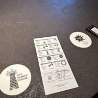 coasters with tarot imaging, beeper device  at Cafe Tarot - カフェタロ in Tokyo