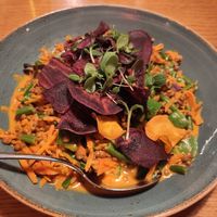Lentil curry with fresh vegetables and sweet potato crisps at Paularei in Salzburg
