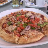 Pizza with vegan cheese topping  at Boston Pizza in Huntsville