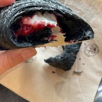 Black croissant with white chocolate and raspberry filling   at The Sanctuary in Berlin