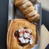 Pistachio pastry and Danese with vegan feta and olives  at The Sanctuary in Berlin