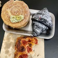 Roll with pistachio, croissant with raspberry and some creamy vanilla foam and foccasia with tomatoes  at The Sanctuary in Berlin