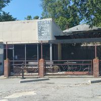front of building at Sticks and Stones Clay Oven Pizza in Greensboro