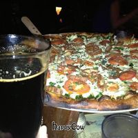 Vegan cheese pizza and beer at Sticks and Stones Clay Oven Pizza in Greensboro