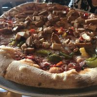 Vegan chicken and peppers at Sticks and Stones Clay Oven Pizza in Greensboro