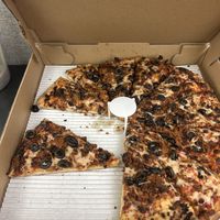 Vegan pie with sausage and olives   at Delish Pizza in Sacramento