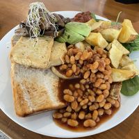 Vegan Breakfast of tofu, toast, mushrooms, beans, potato, avocado, spinach and tomato jam  at Two Birds Eatery in Hamilton