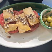 Vegan cheese and tomato’s toastada!! Really good   at La Cabra Feliz Bar Etico in Mallorca