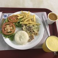 Feijão, arroz, farofa de banana, batata frita e salada com suco de laranja  at CGB - Kikiô Fast Food - PT in Varzea Grande