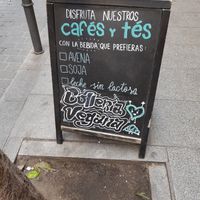 Sign on the street advertising vegan baked goods at La Barra Dulce in Madrid