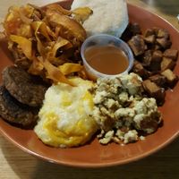 Brunch bowl!!! ? Creamy grits, fluffy biscuit, lovely fruit spread, yummy sausage, so good!!!  at Bean Vegan Cuisine in Charlotte