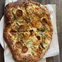 A delicious jalapeño popperoni pizza. It’s one of the best pizzas I’ve ever had. I should have ordered one to eat now and one for later. Highly recommend !  at Bean Vegan Cuisine in Charlotte